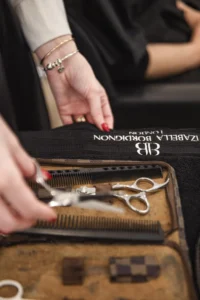 Professional hair cutting tools used in frizzy hair salon treatments London