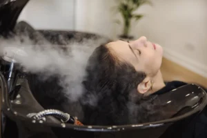 Steam hydration therapy at salon for restoring moisture to frizzy hair
