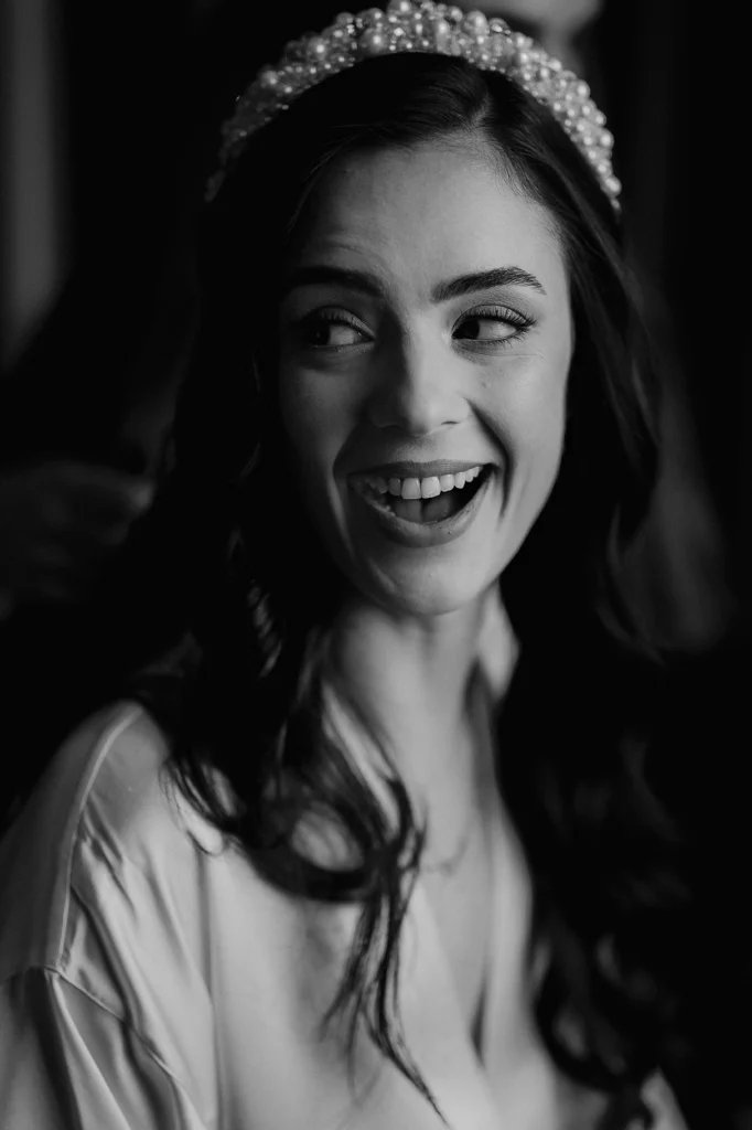 Happy bride smiling during wedding morning preparations