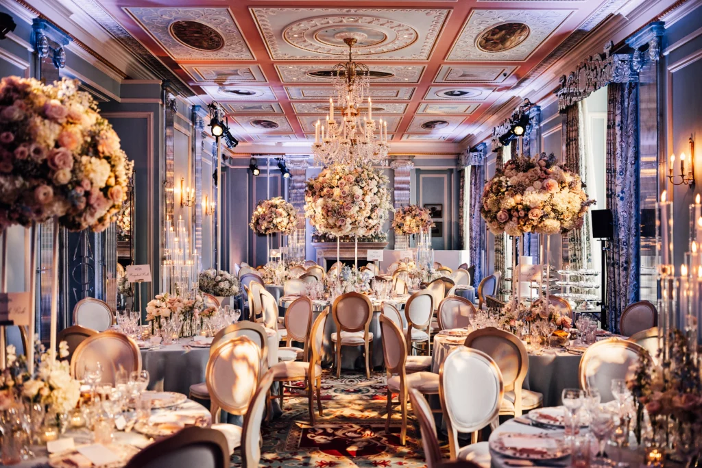 Opulent wedding reception decor with flower arrangements