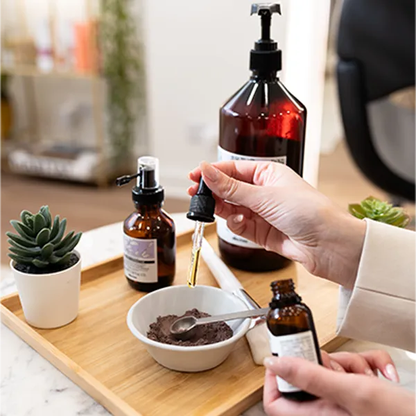 Bespoke hair treatment being prepared by a trichologist in London for scalp health improvement.